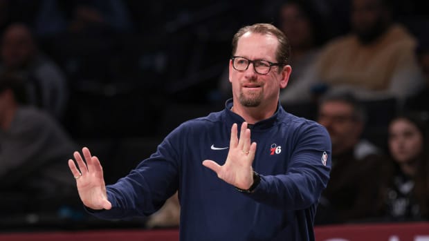 Philadelphia 76ers head coach Nick Nurse reacts during an NBA game.